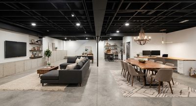 How to Zone an Open Basement Without Building Walls — Furniture, Rugs, and Lighting as Room Dividers